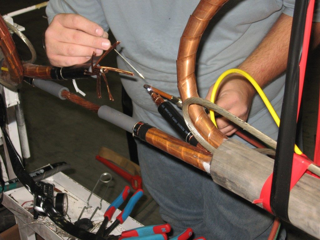 Technician splicing a mining cable