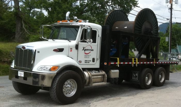 Xpress spool truck carrying a cable reel