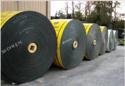 Rolls of new conveyor belt